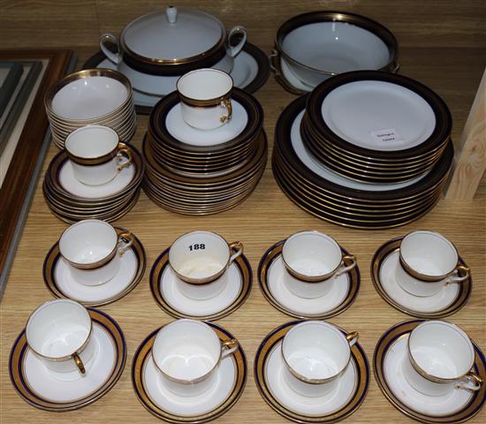 A quantity of blue and gilt dinnerware